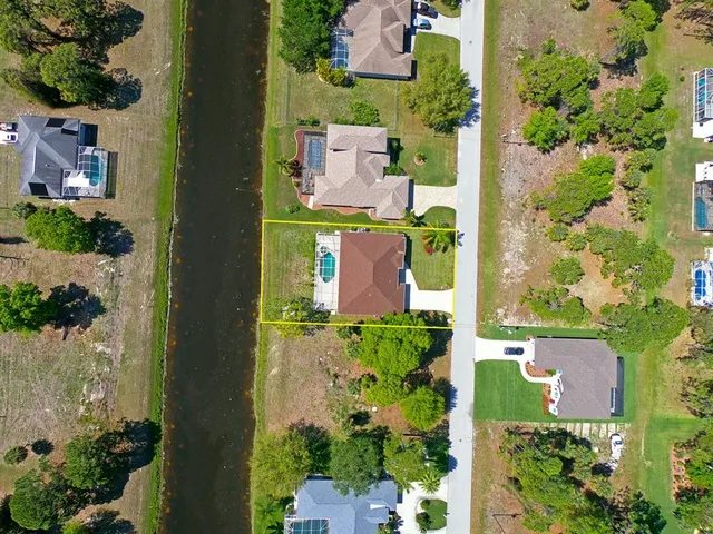 a view of a swimming pool with lounge chair