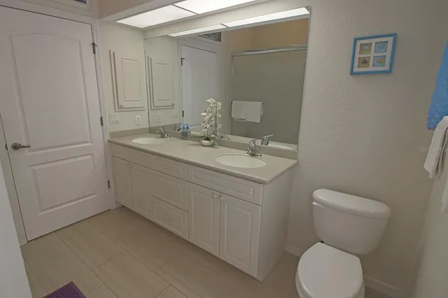 a view of a backyard with plants and a garden