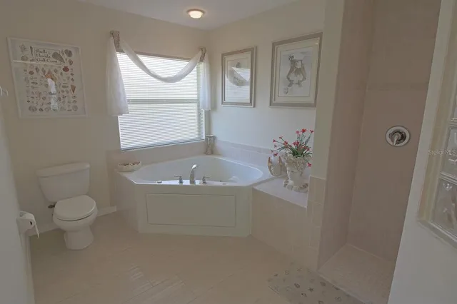 a view of a lake with houses in the back