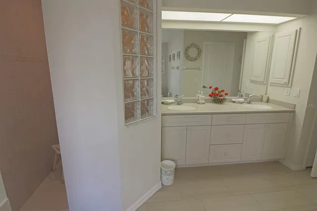 a view of a house with yard and sitting area