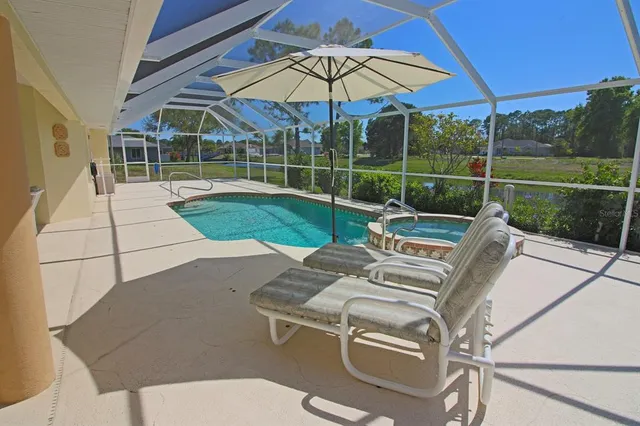 a utility room with dryer washer and a view of kitchen