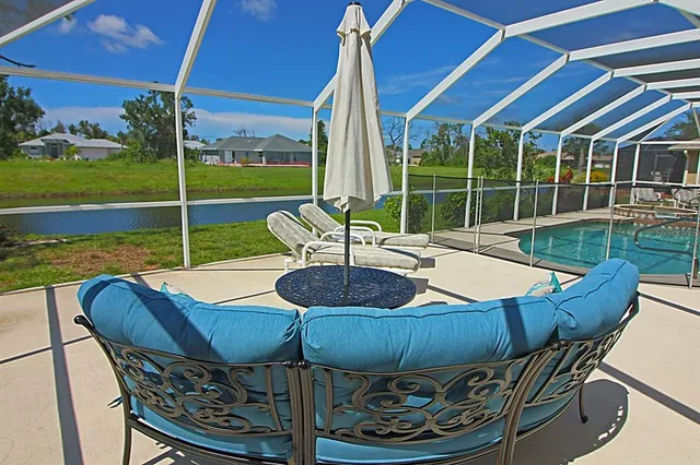 a view of a lake with houses in the background