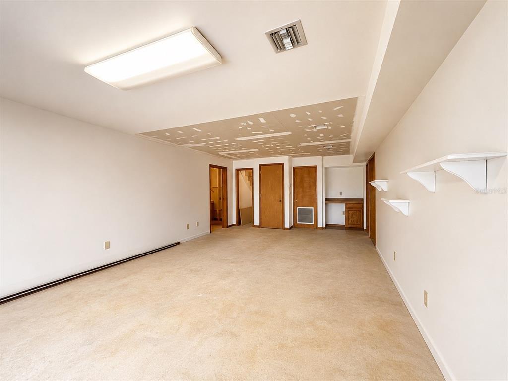 7119 Immokalee Road Keystone Heights, FL 32656 - Photo 35 of 50 an empty room with windows