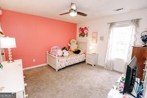 89 Copeland Road Newnan, GA 30263 - Photo 19 of 30 a bedroom with furniture and a flat screen tv
