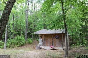 89 Copeland Road Newnan, GA 30263 - Photo 26 of 30 a view of a small house with lots of trees and plants