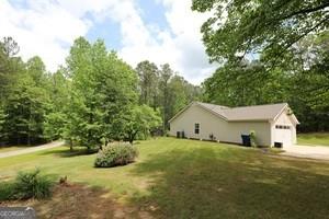 89 Copeland Road Newnan, GA 30263 - Photo 29 of 30 a view of a house with backyard and garden