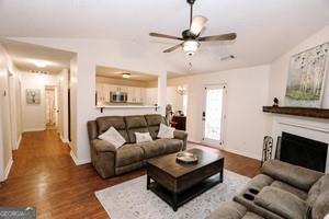 89 Copeland Road Newnan, GA 30263 - Photo 5 of 30 a living room with furniture and a fireplace