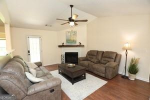 89 Copeland Road Newnan, GA 30263 - Photo 7 of 30 a living room with furniture and a fireplace