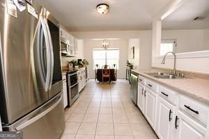 89 Copeland Road Newnan, GA 30263 - Photo 8 of 30 a kitchen with stainless steel appliances granite countertop a refrigerator and a sink