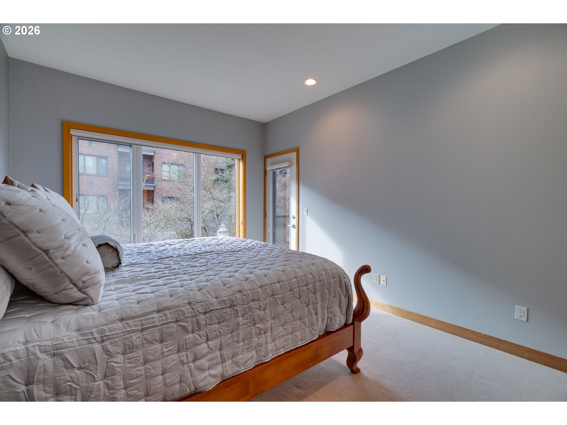 300 West 8th Street, Unit 236E Vancouver, WA 98660 - Photo 22 of 46 a bedroom with a bed and large windows