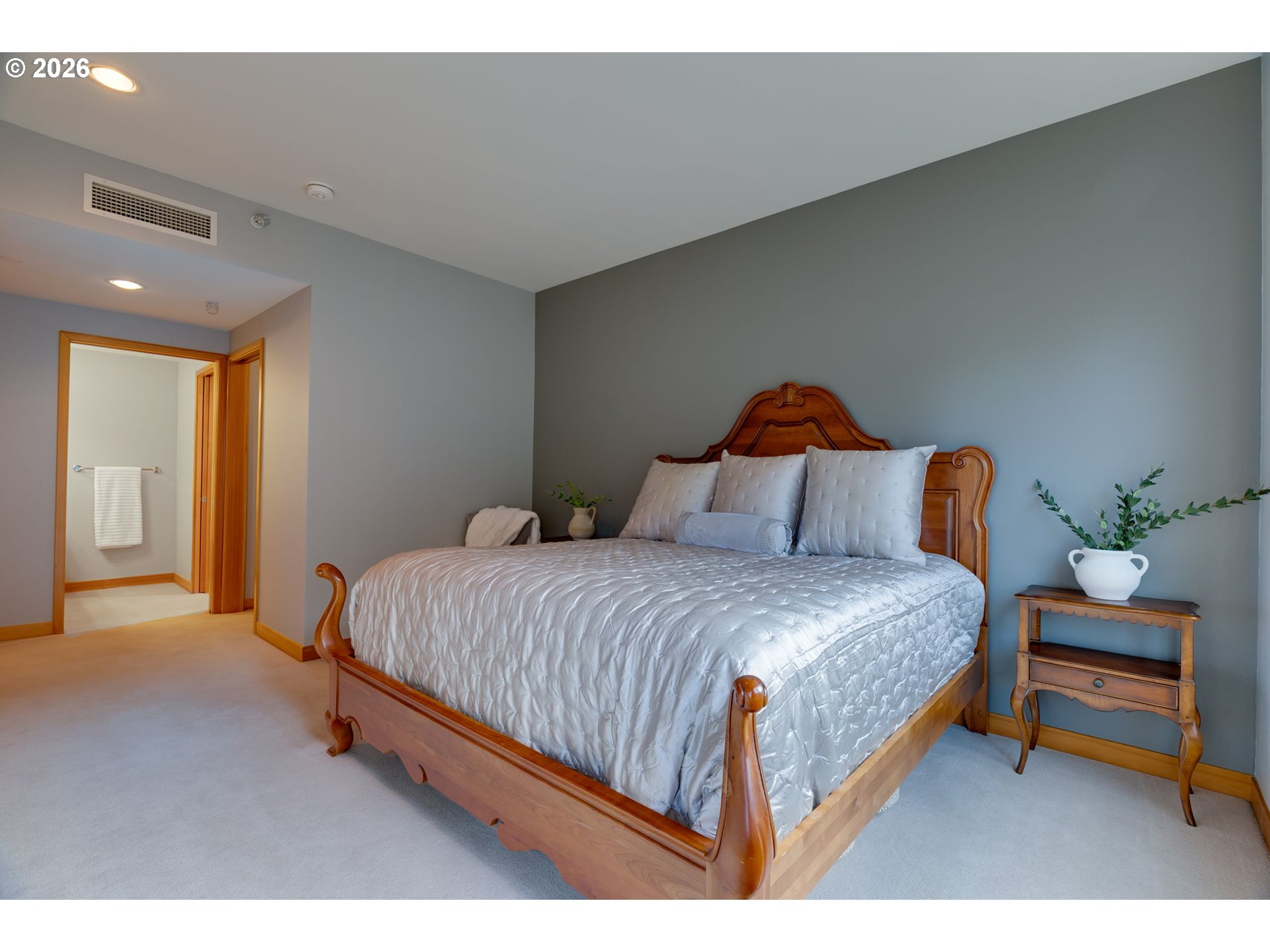 300 West 8th Street, Unit 236E Vancouver, WA 98660 - Photo 23 of 46 a bedroom with a bed a lamp and a window