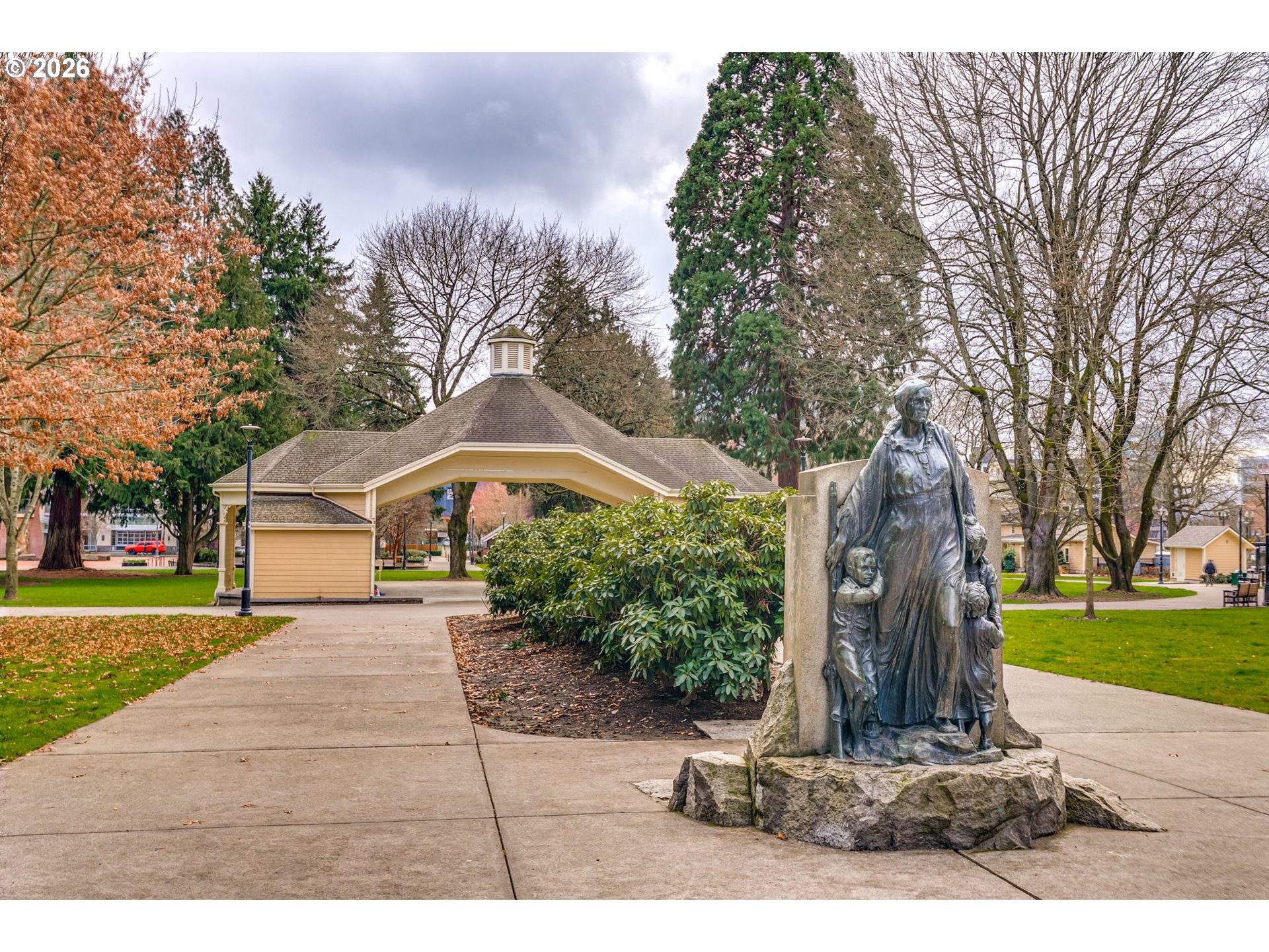 300 West 8th Street, Unit 236E Vancouver, WA 98660 - Photo 36 of 46 a front view of a house with a yard and trees