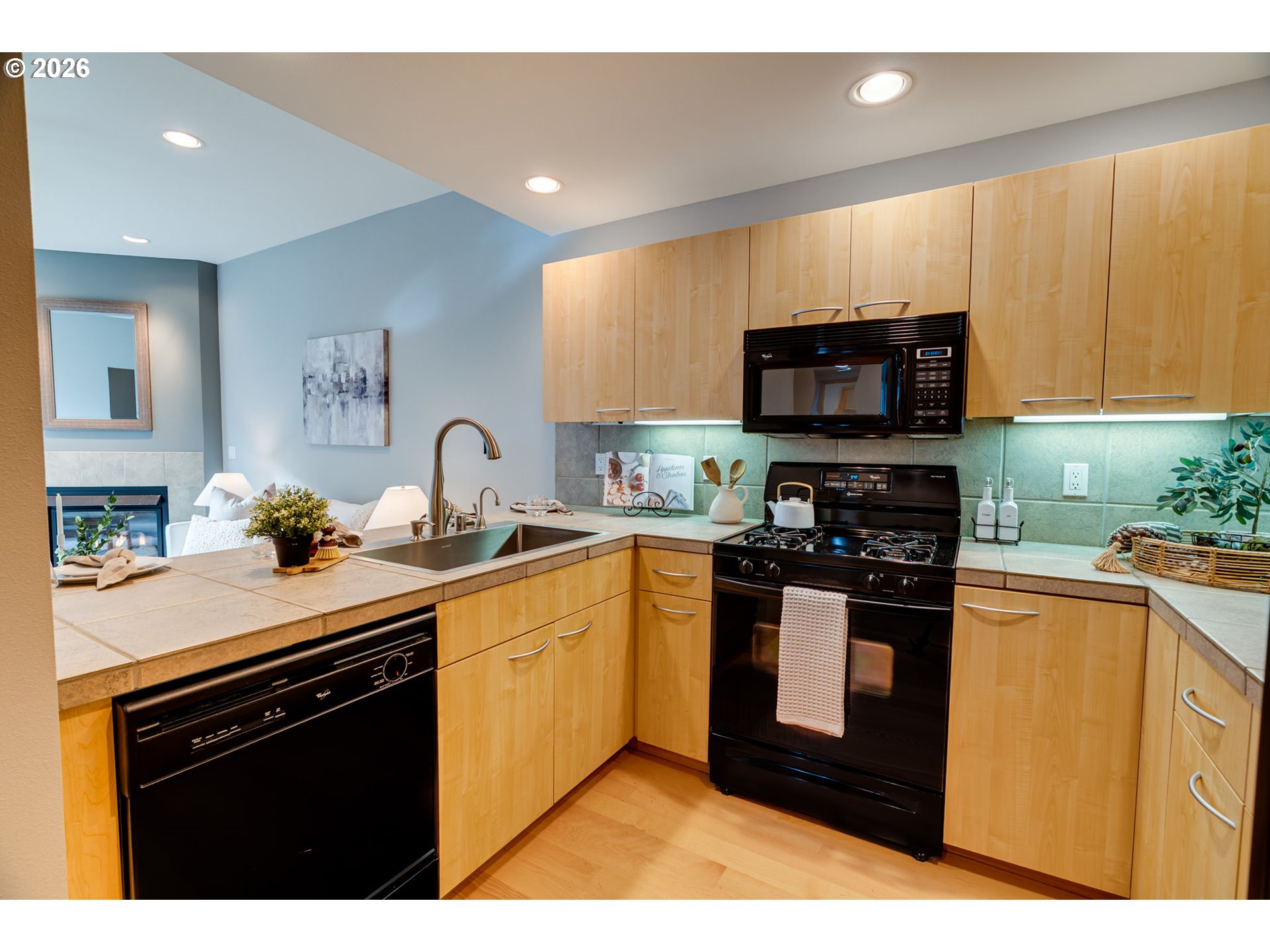 300 West 8th Street, Unit 236E Vancouver, WA 98660 - Photo 5 of 46 a kitchen with stainless steel appliances a sink a stove top oven a counter space and cabinets