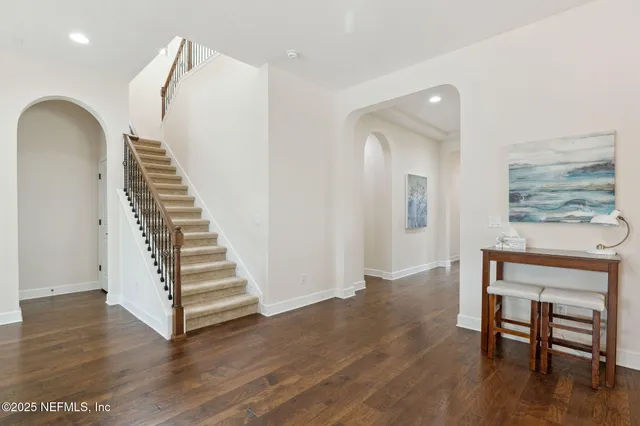 a kitchen with granite countertop a stove and a microwave