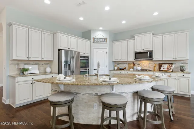 a bedroom with a bed and a dresser in it