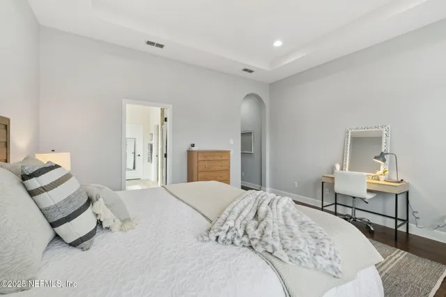 a view of room with furniture and wooden floor