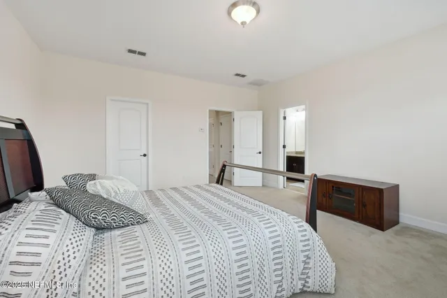 a view of a patio with table and chairs potted plants and palm tree