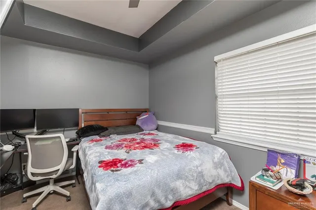 a bedroom with a bed and a chair