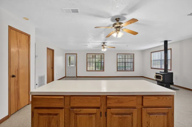 a kitchen with a cabinets and chandelier