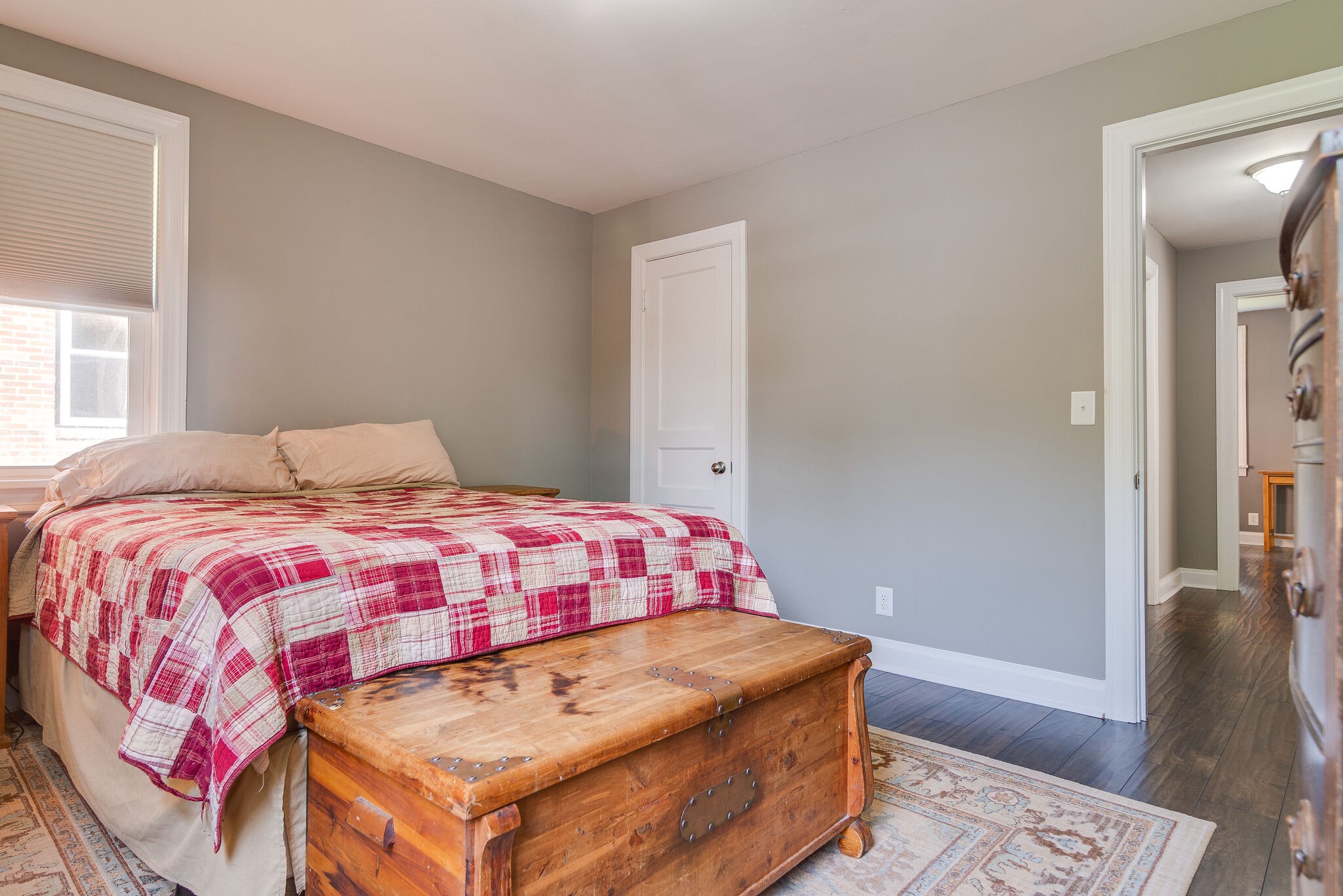 212 Neelys Bend Road Madison, TN 37115 - Photo 14 of 24 a bedroom with a bed and wooden floor