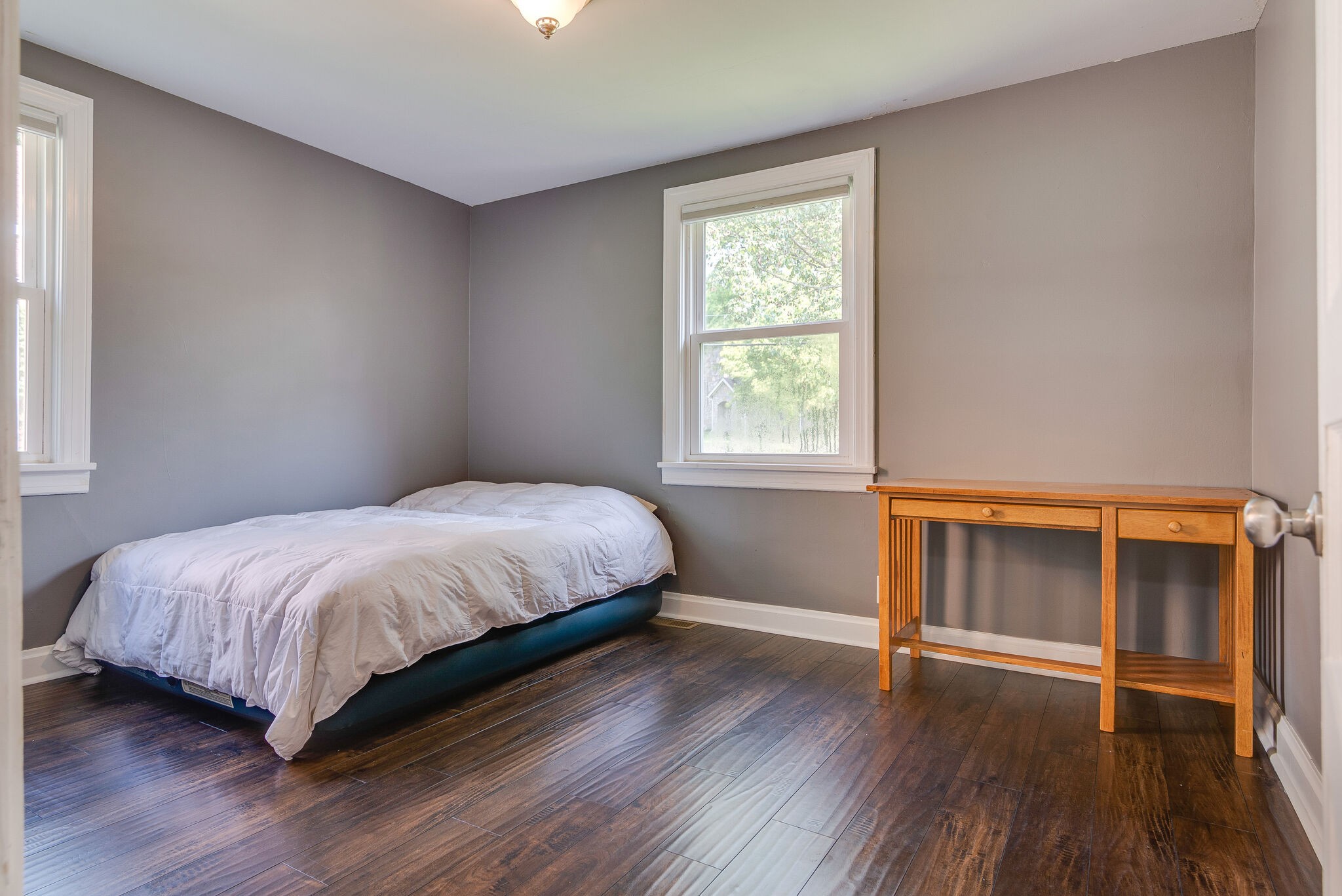 212 Neelys Bend Road Madison, TN 37115 - Photo 17 of 24 a bedroom with a bed and window