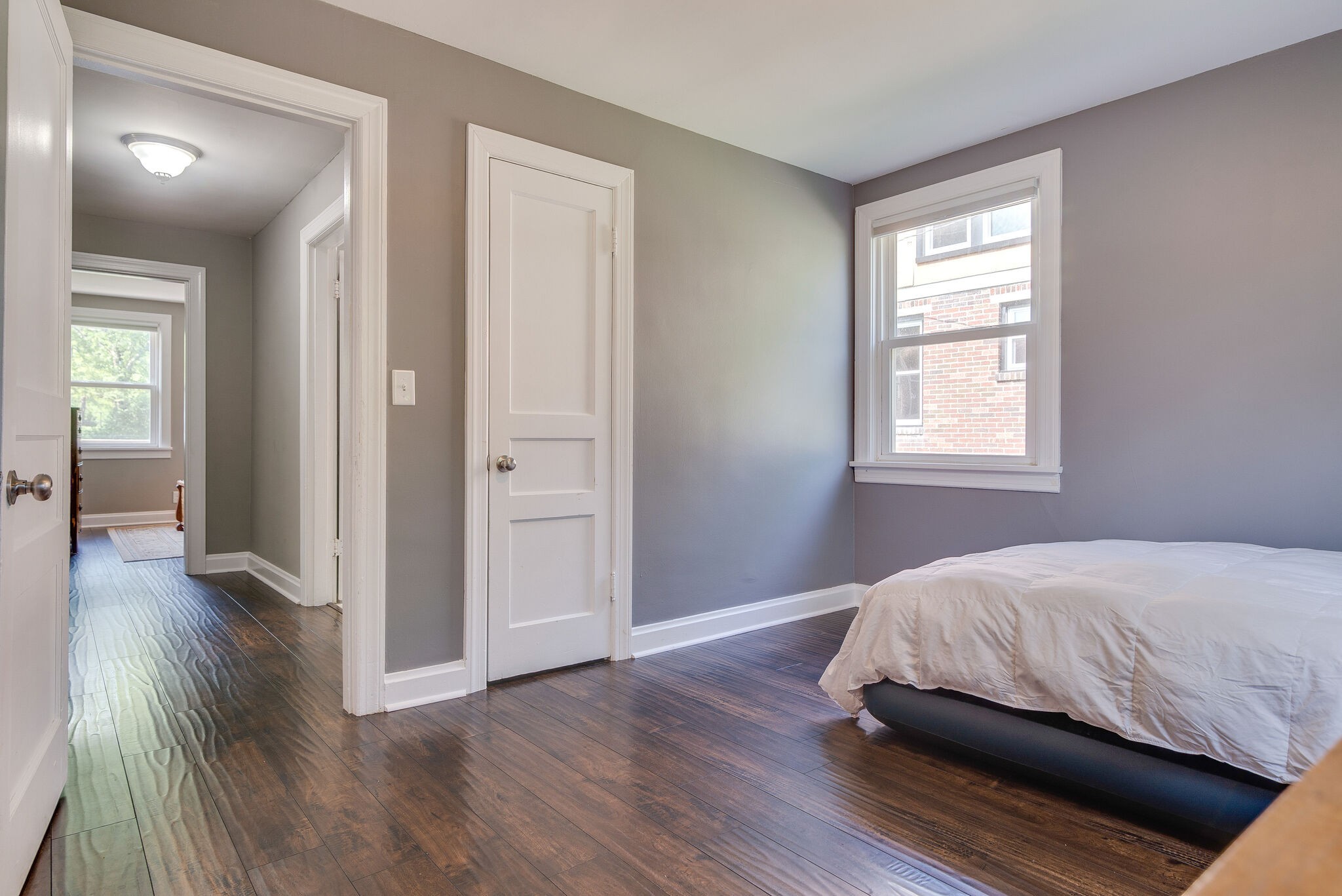 212 Neelys Bend Road Madison, TN 37115 - Photo 18 of 24 a bedroom with a bed and wooden floor