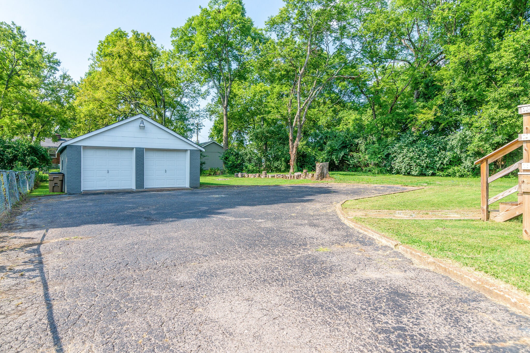 212 Neelys Bend Road Madison, TN 37115 - Photo 23 of 24 a front view of a house with a yard and trees