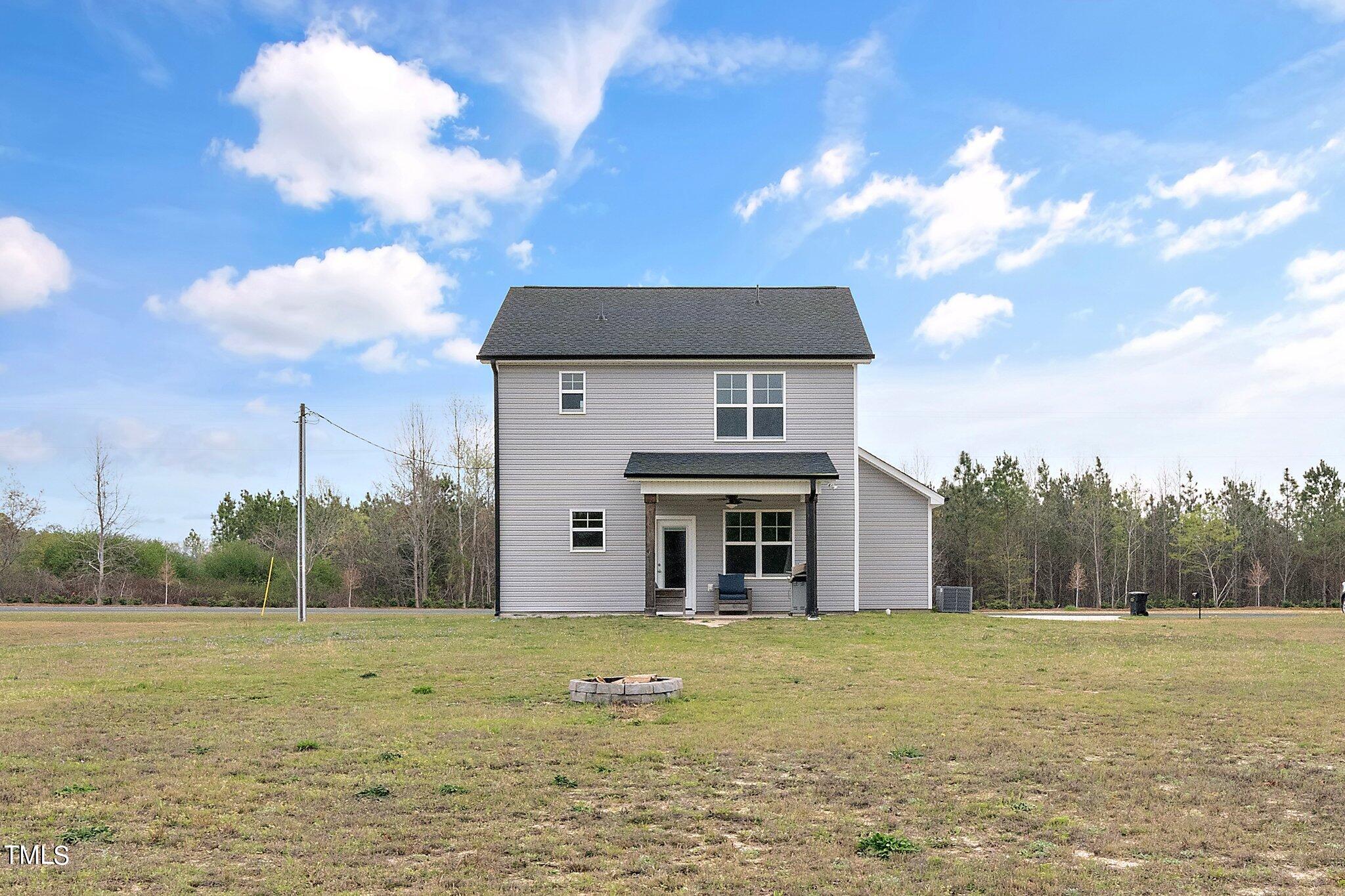 5944 Rosser Pittman Road Sanford, NC 27332 - Photo 13 of 13 a view of a house with a yard