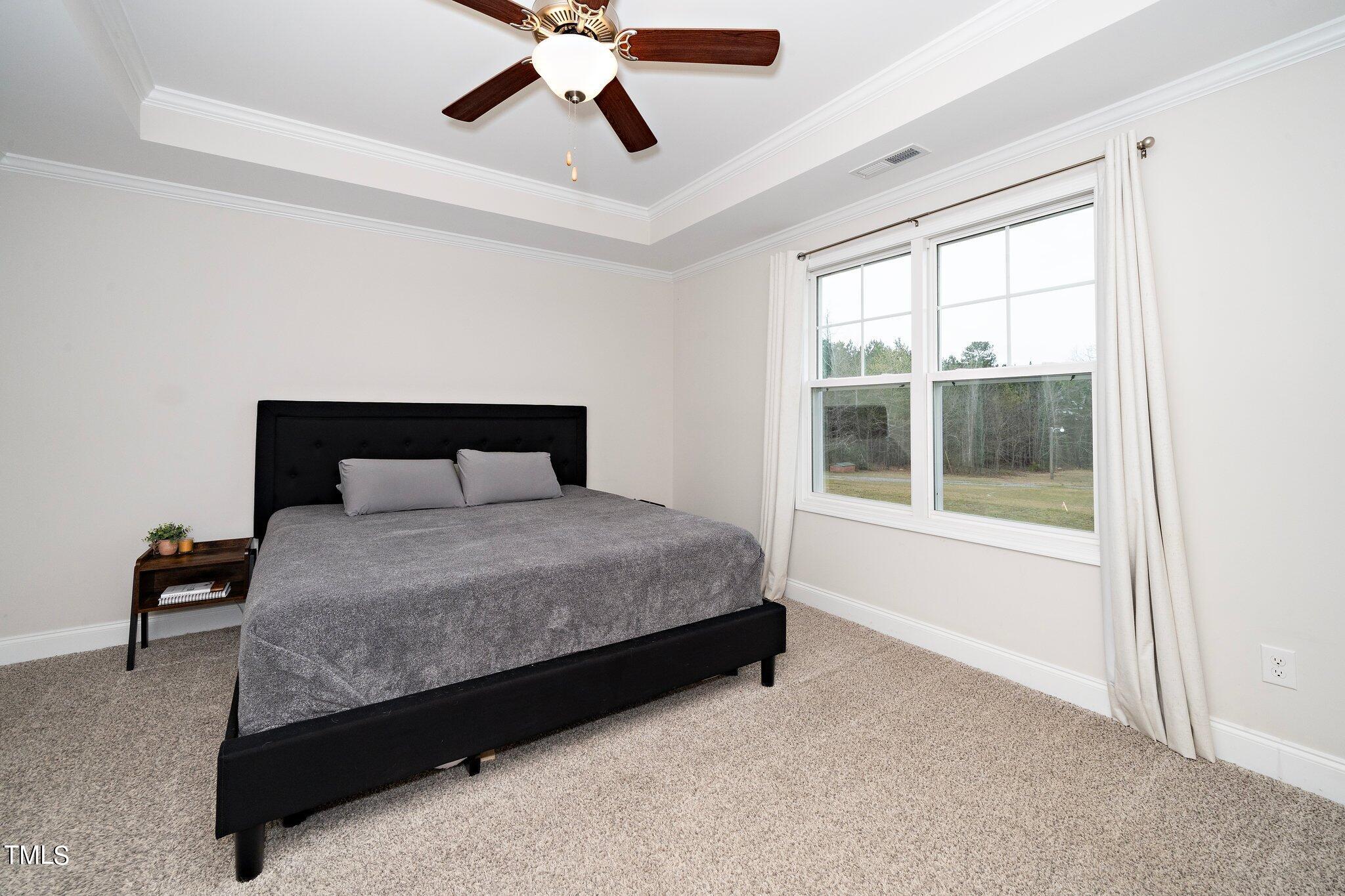 5944 Rosser Pittman Road Sanford, NC 27332 - Photo 8 of 13 a bedroom with a bed and window