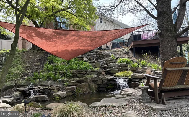 a view of a backyard with sitting area and furniture