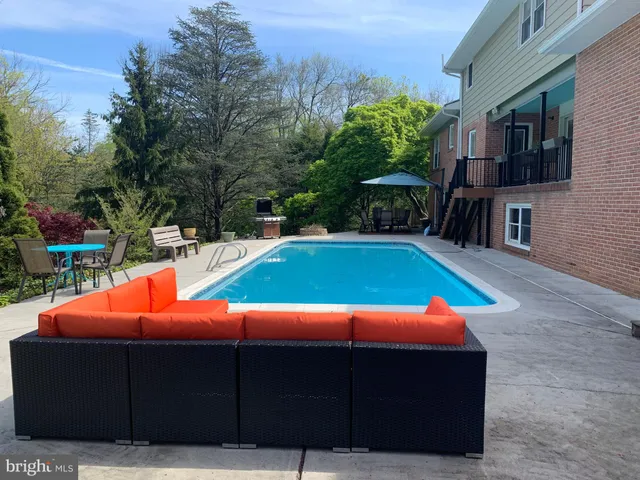 a view of a yard with an outdoor seating