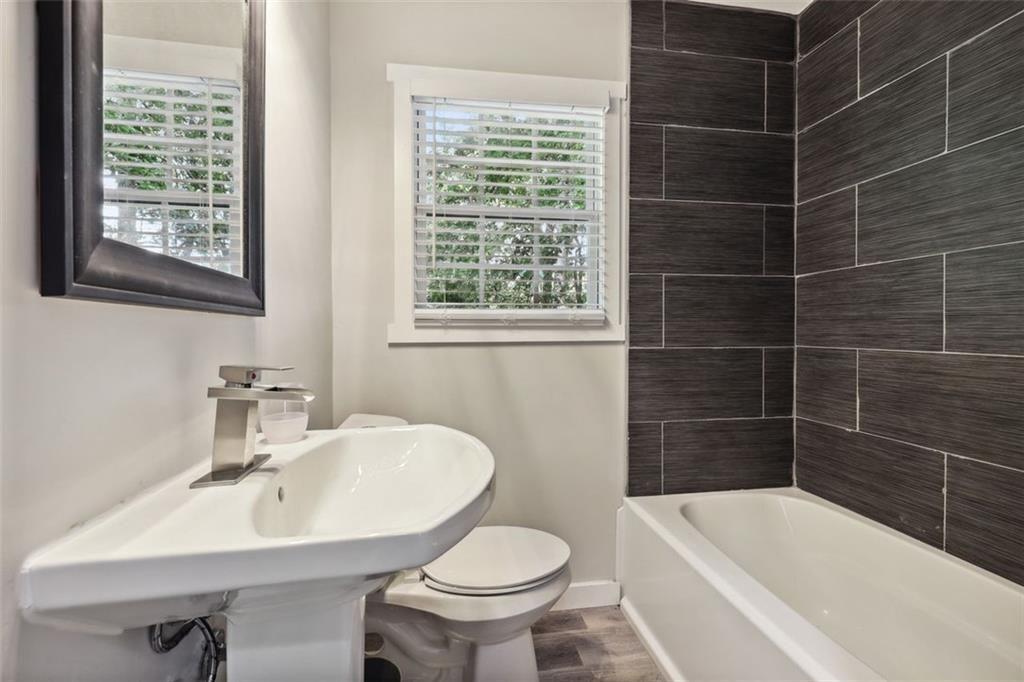 1561 Pontiac Place Southeast Atlanta, GA 30315 - Photo 11 of 14 a bathroom with a sink toilet and shower