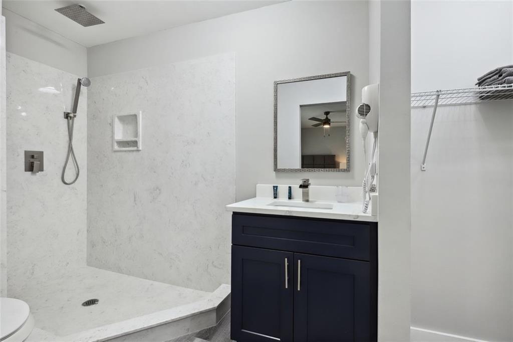 1561 Pontiac Place Southeast Atlanta, GA 30315 - Photo 13 of 14 a bathroom with a sink a toilet and shower