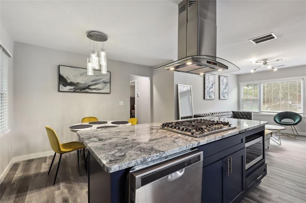 1561 Pontiac Place Southeast Atlanta, GA 30315 - Photo 2 of 14 a kitchen with a table and chairs in it