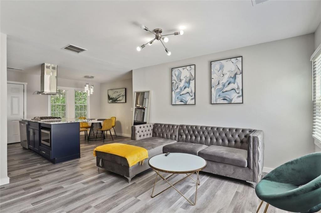 1561 Pontiac Place Southeast Atlanta, GA 30315 - Photo 4 of 14 a living room with furniture and a wooden floor