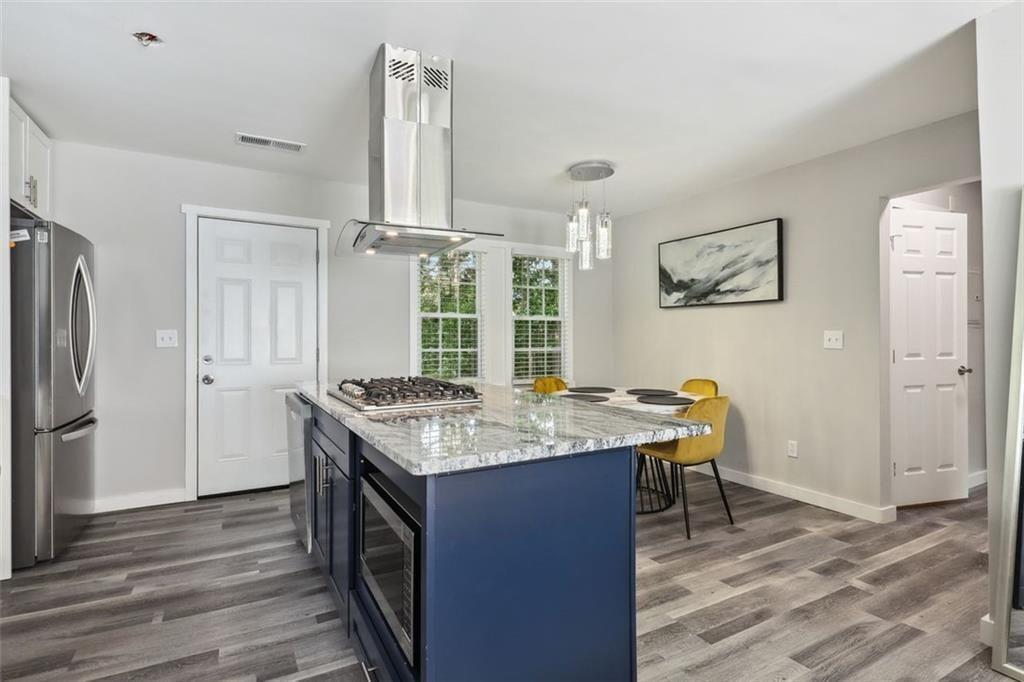 1561 Pontiac Place Southeast Atlanta, GA 30315 - Photo 7 of 14 a kitchen with a stove a refrigerator and a stove