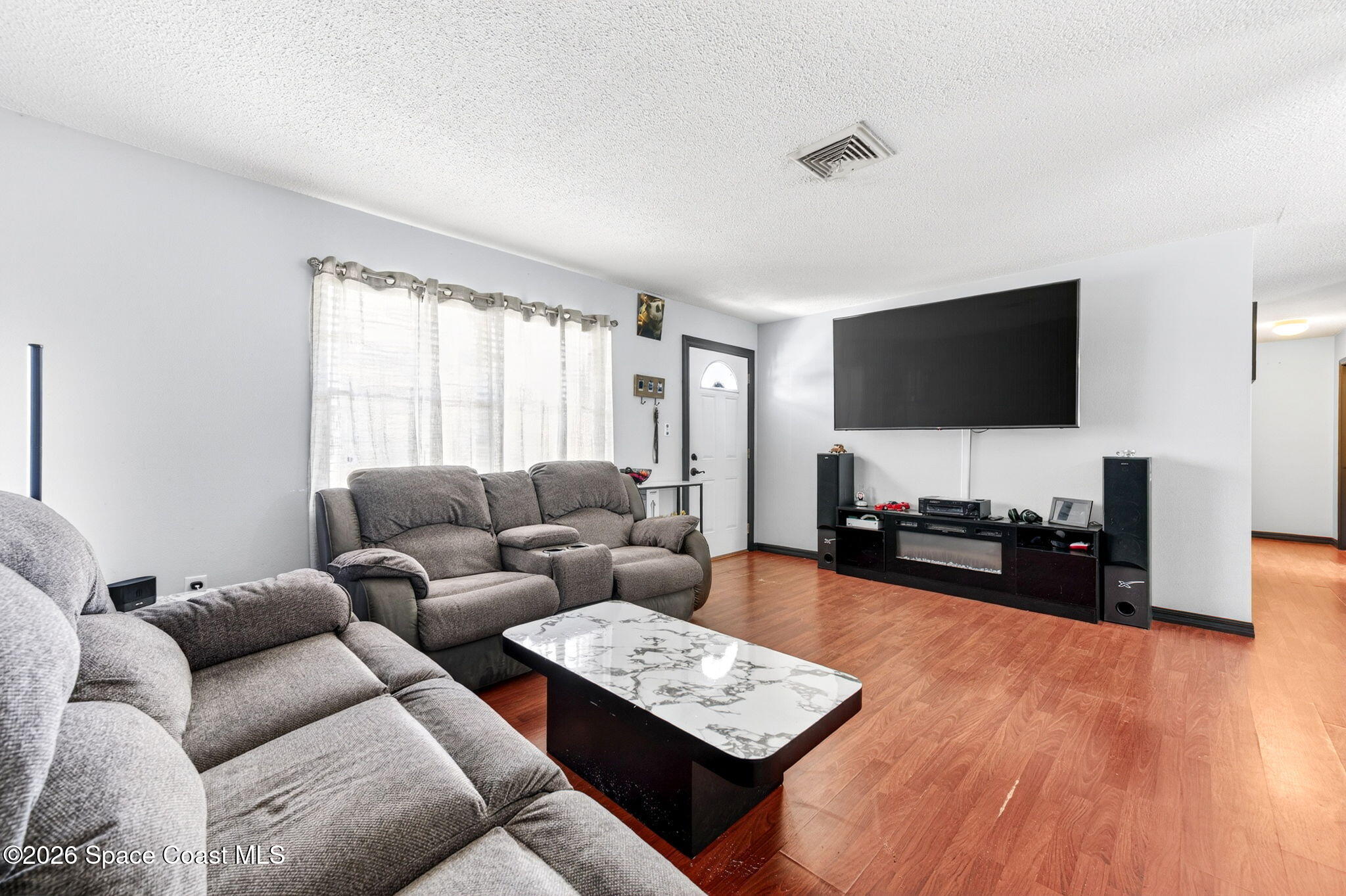 3300 Argyle Road Titusville, FL 32796 - Photo 14 of 29 a living room with furniture and a flat screen tv