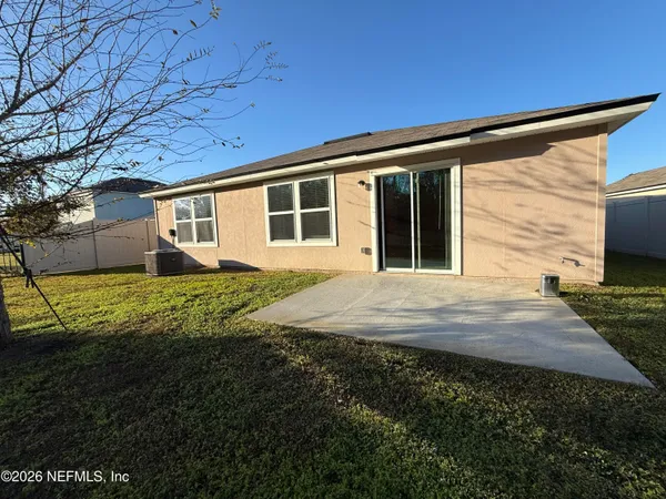a house view with a backyard space