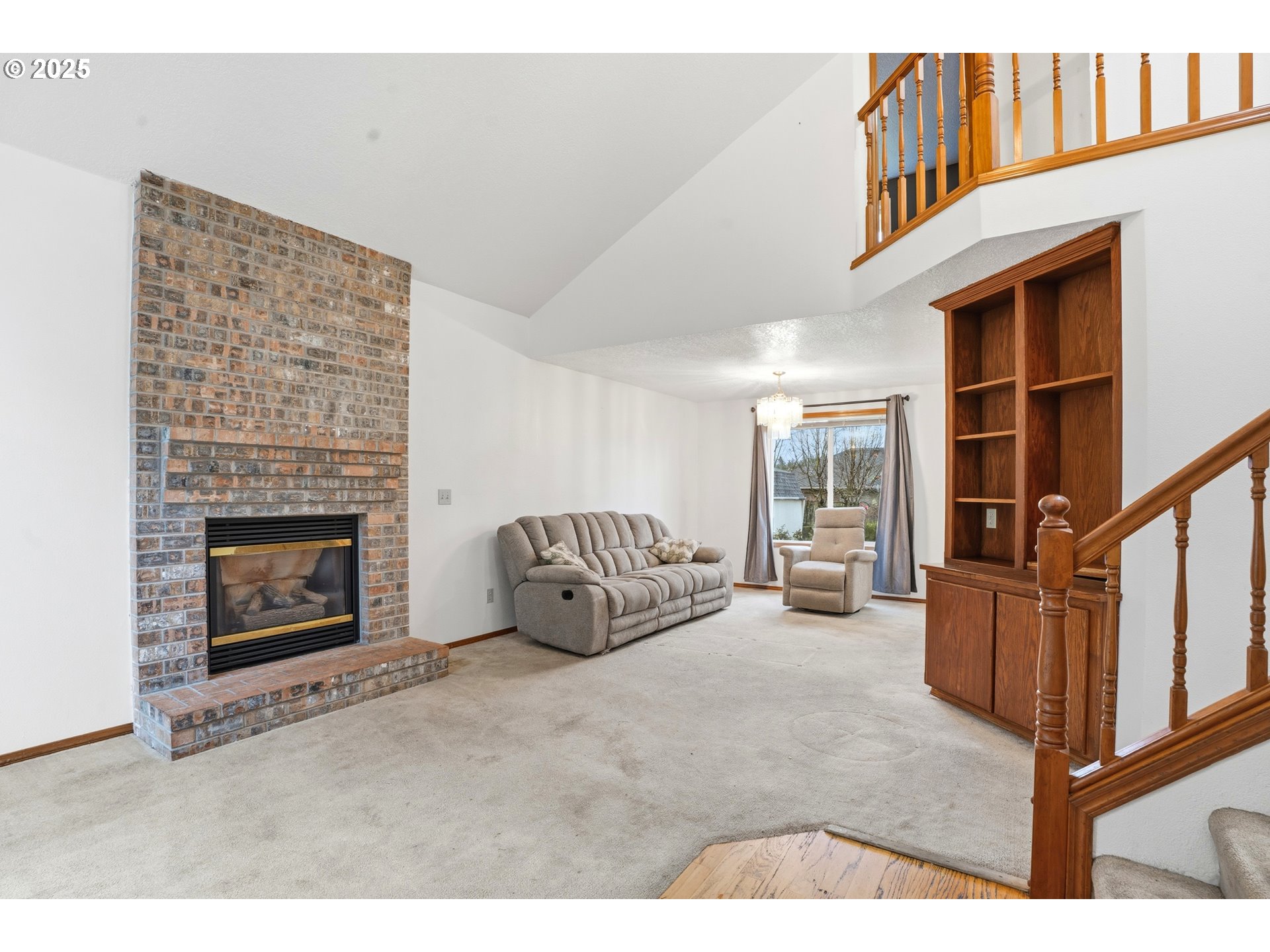 4724 Southeast Powell Valley Road Gresham, OR 97080 - Photo 3 of 28 a living room with furniture a fireplace and a large window