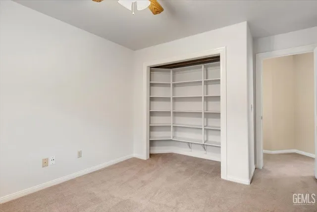 a view of an empty room with a bathroom
