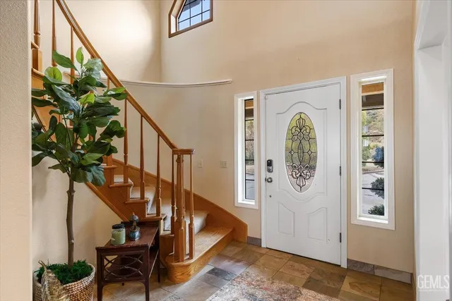 a view of entryway with wooden floor and a potted plant