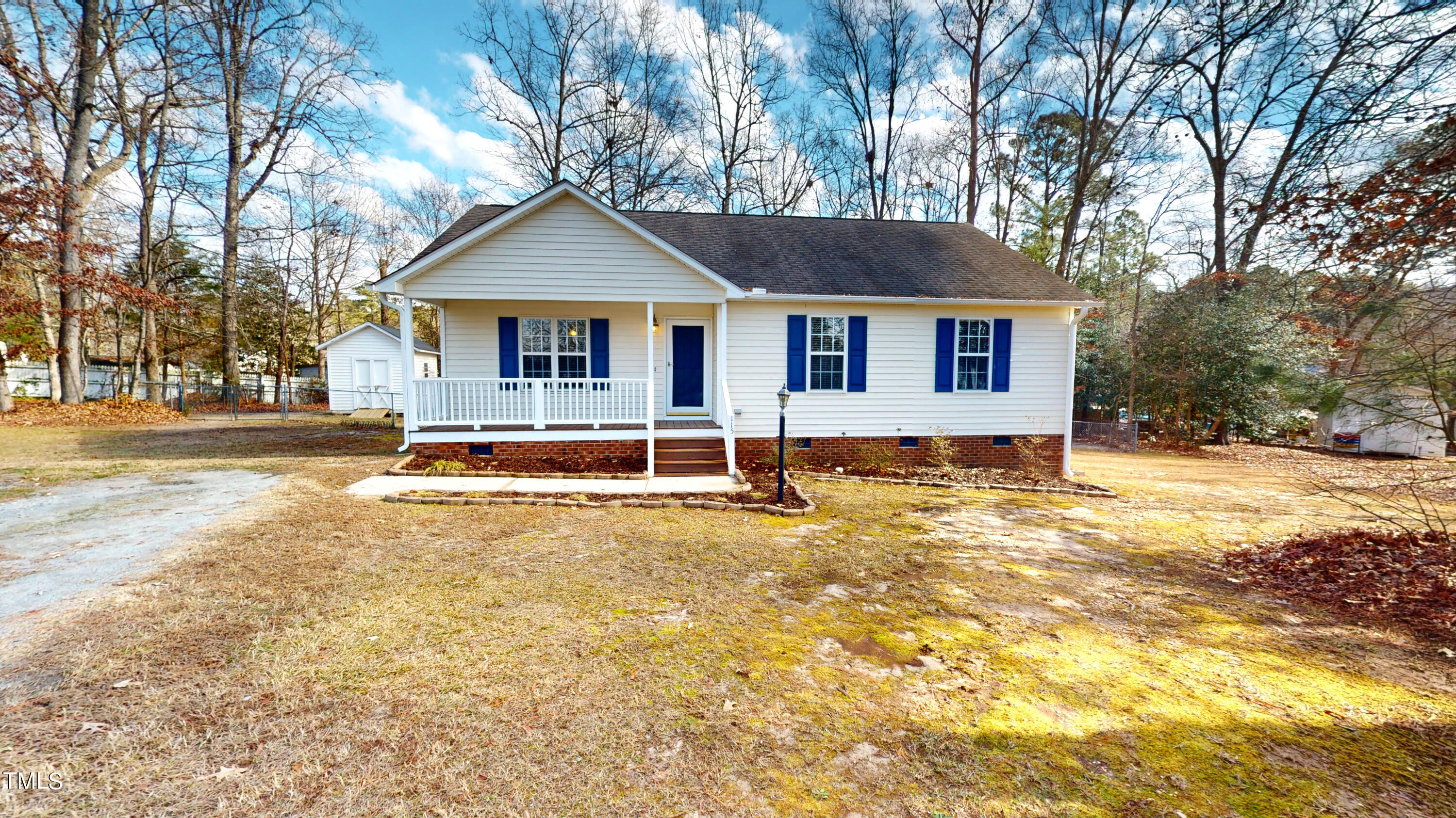 115 Stoneview Circle Smithfield, NC 27577 - Photo 1 of 35 a view of a house with snow on the road and trees