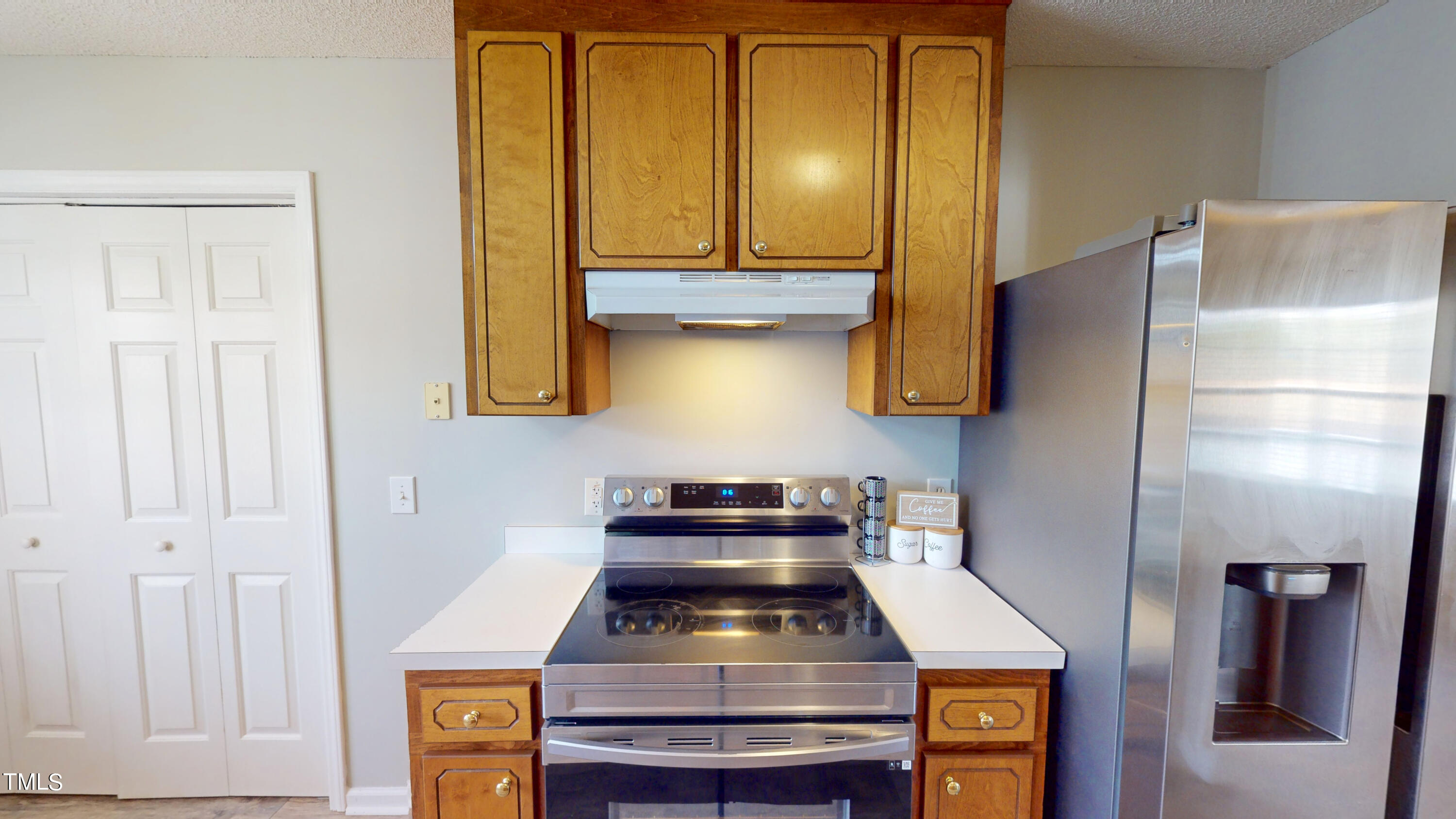 115 Stoneview Circle Smithfield, NC 27577 - Photo 11 of 35 a kitchen with stainless steel appliances granite countertop a stove and a refrigerator