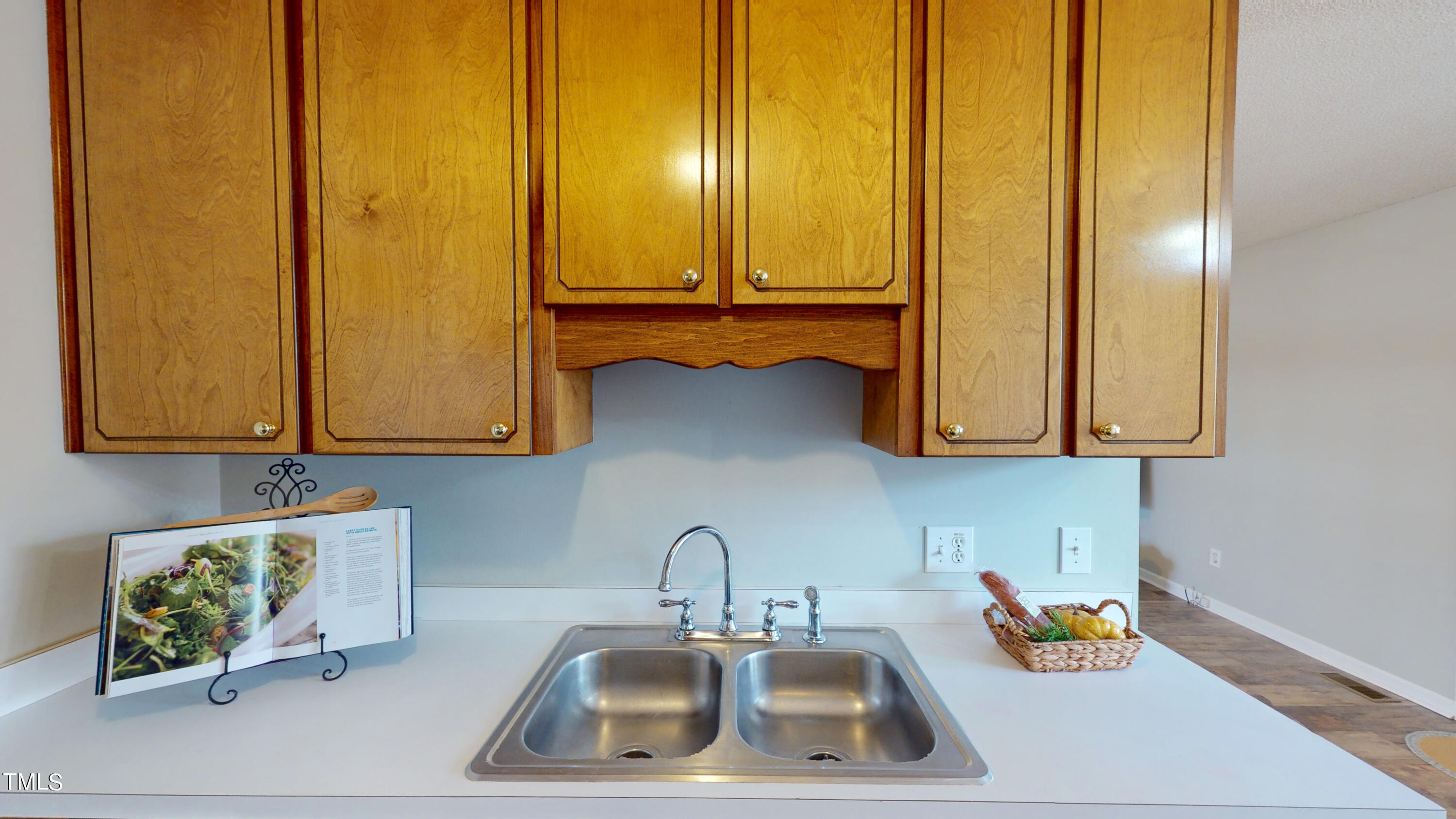 115 Stoneview Circle Smithfield, NC 27577 - Photo 12 of 35 a kitchen with blue sink and painted walls