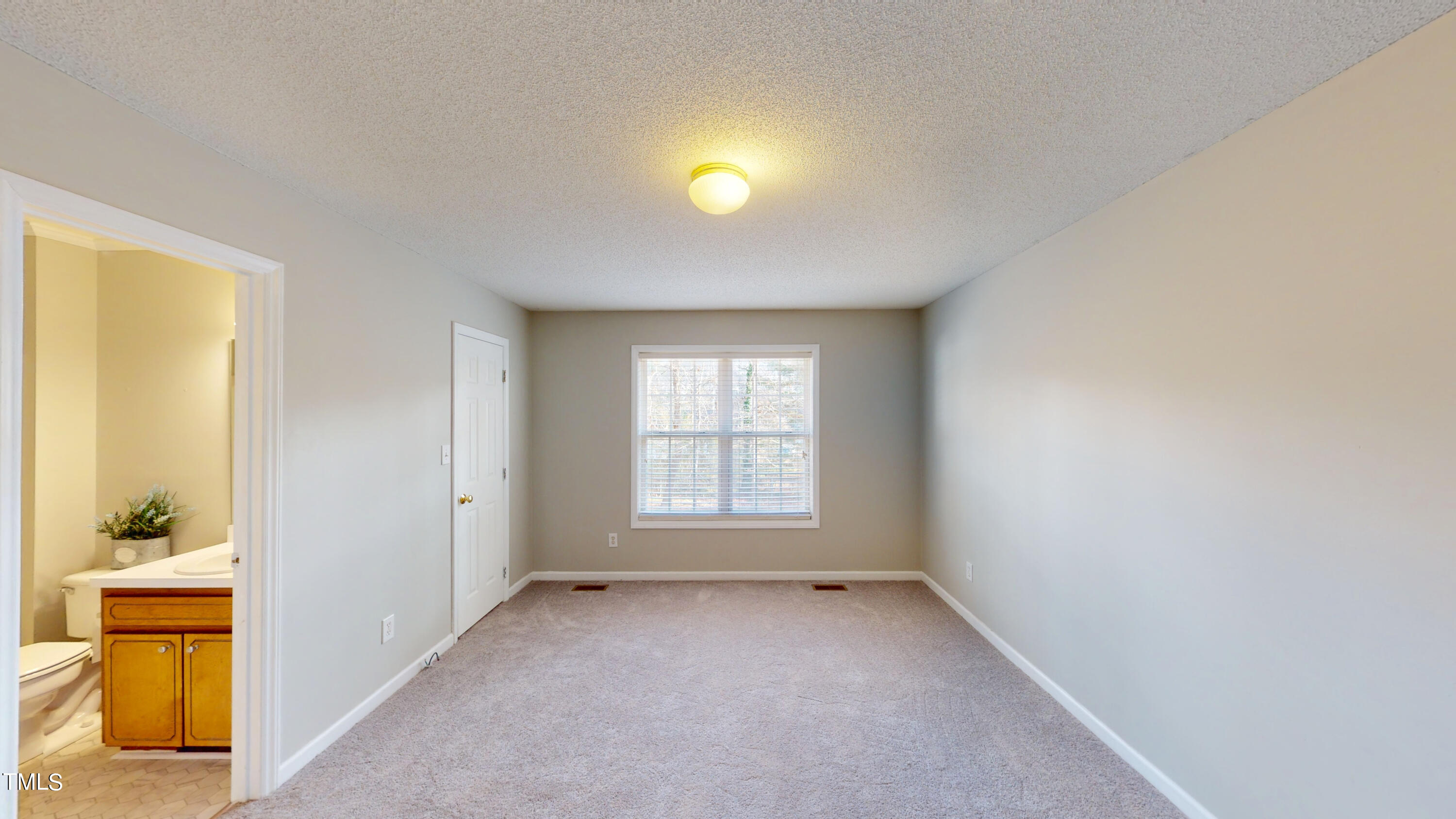115 Stoneview Circle Smithfield, NC 27577 - Photo 13 of 35 a view of empty room with wooden floor and fan