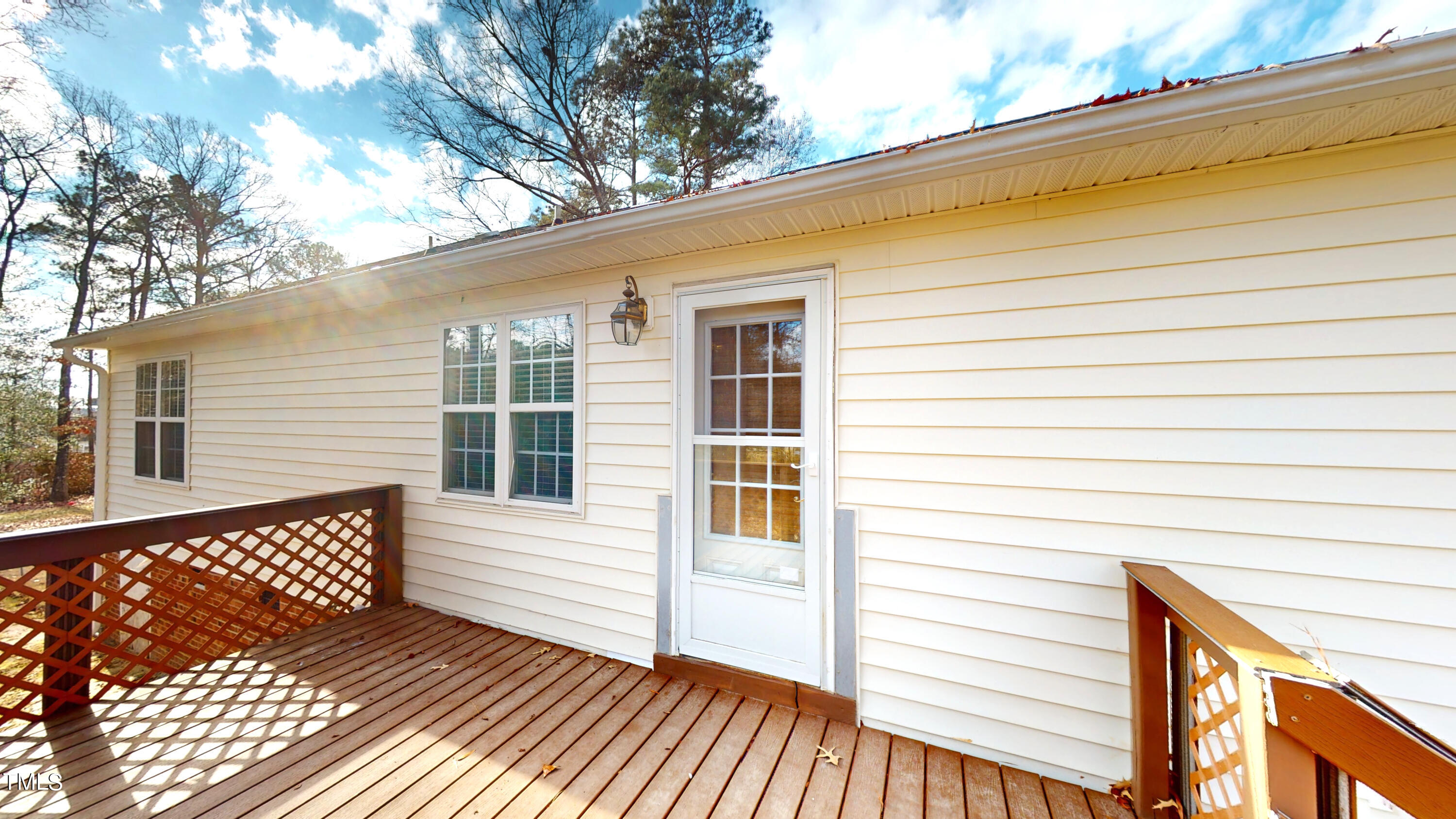 115 Stoneview Circle Smithfield, NC 27577 - Photo 16 of 35 a view of a wooden balcony with a door and wooden floor