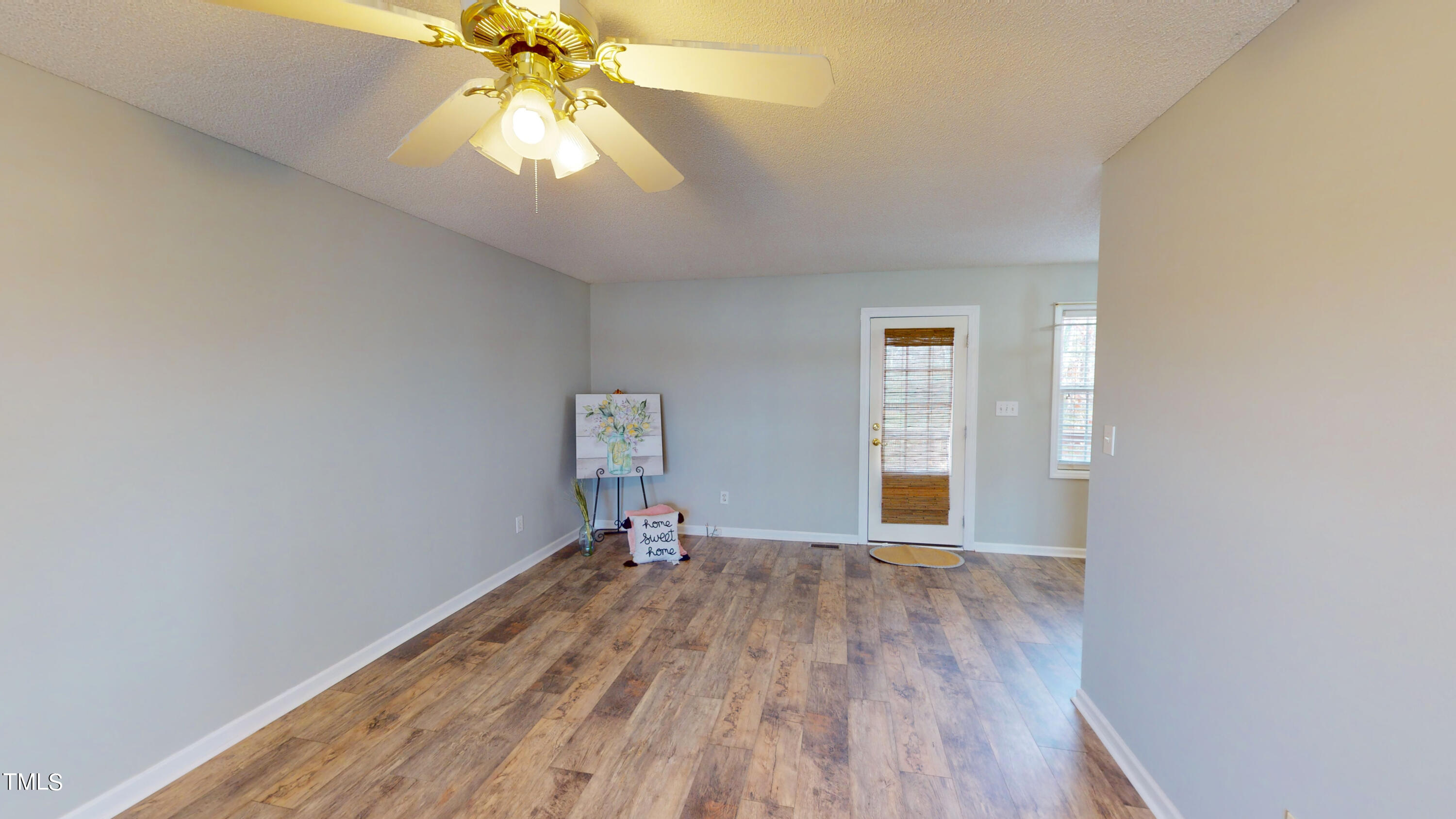 115 Stoneview Circle Smithfield, NC 27577 - Photo 17 of 35 a view of empty room with wooden floor and fan