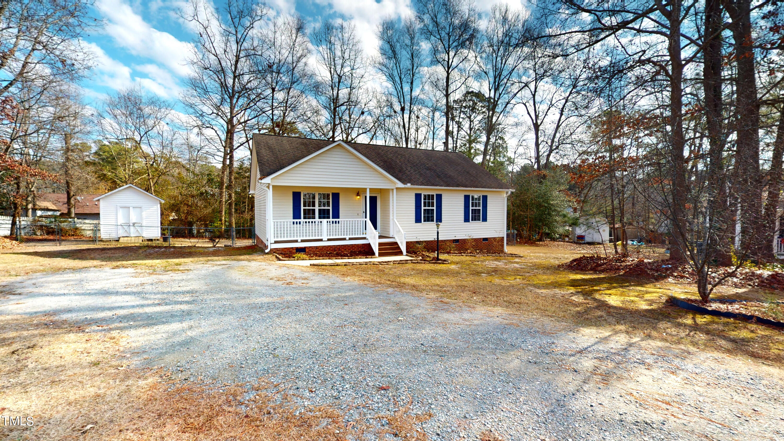 115 Stoneview Circle Smithfield, NC 27577 - Photo 2 of 35 a swimming pool view with large trees and wooden fence