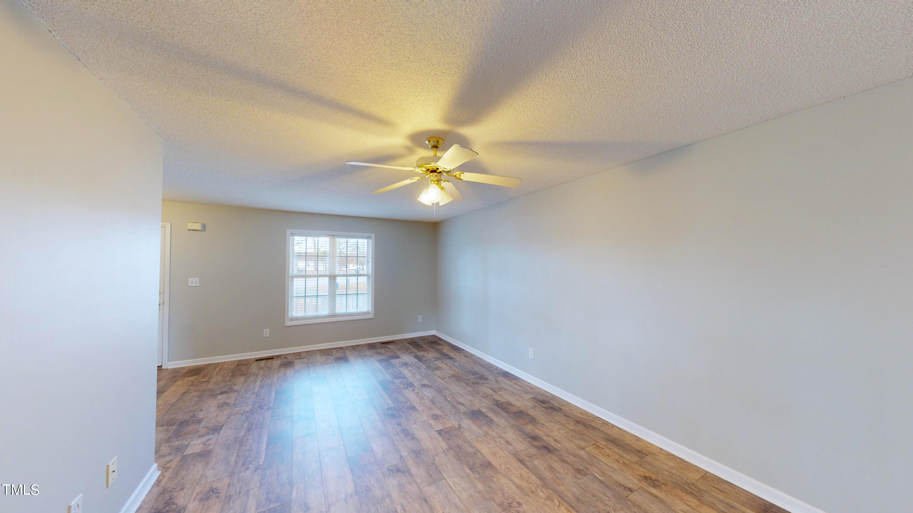 115 Stoneview Circle Smithfield, NC 27577 - Photo 21 of 35 wooden floor in an empty room with a window