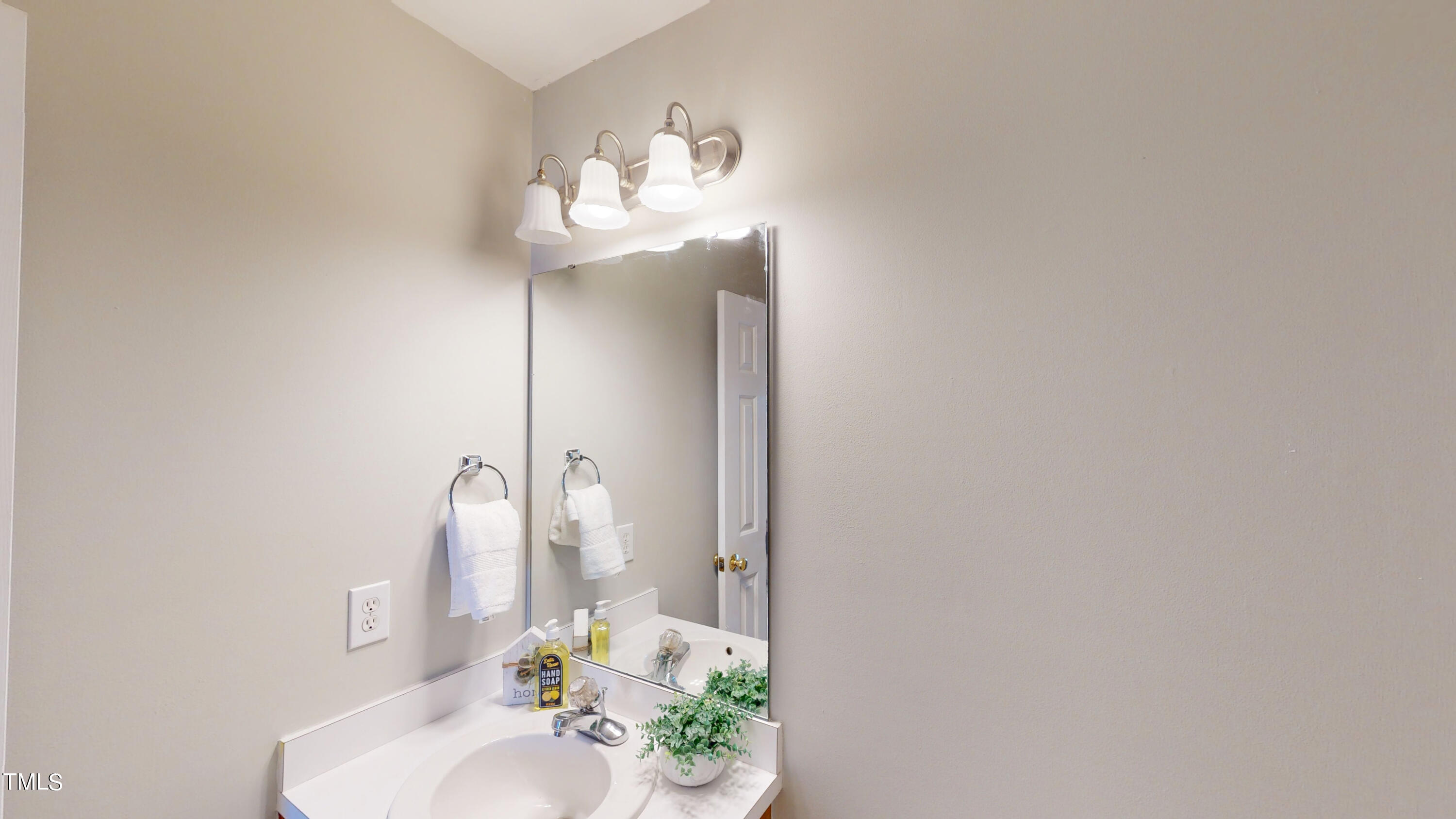 115 Stoneview Circle Smithfield, NC 27577 - Photo 27 of 35 a bathroom with a sink and a mirror